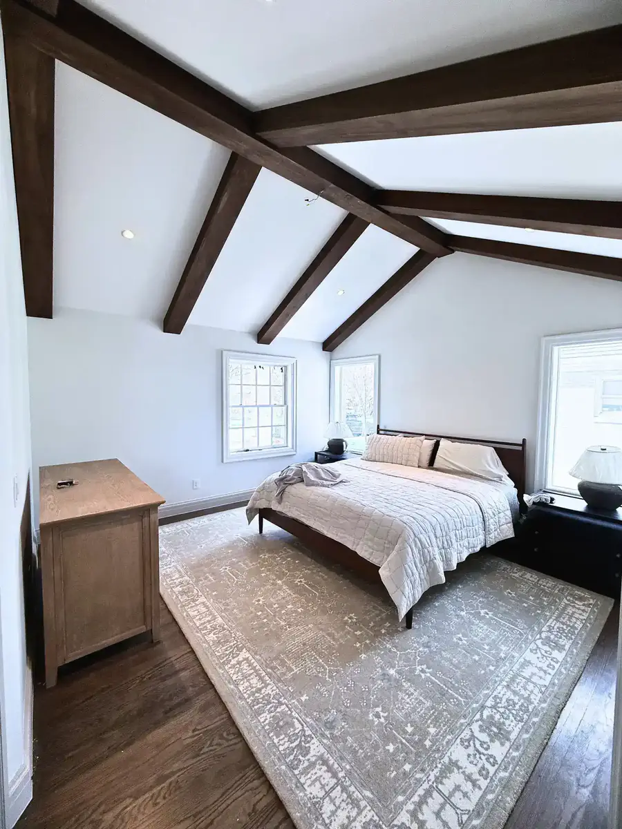 Custom ceiling beams and finish carpentry showing tight joints and precise layout by Matos Construction